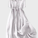 Sara – Elegantna midi haljina s gumbima od svile